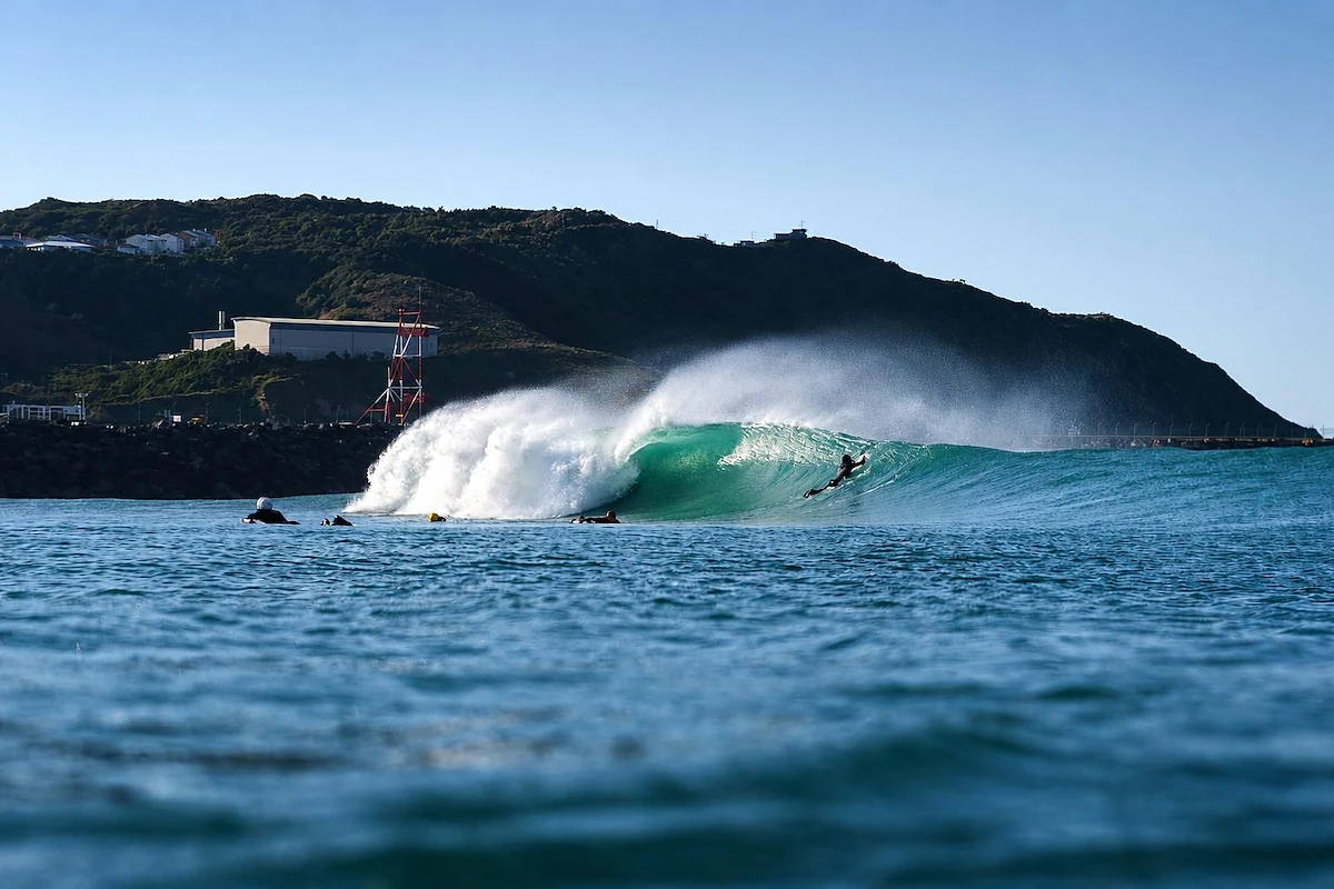 Surfer riding a barrel at Lyall Bay beach, Wellington